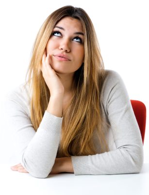 Portrait of beautiful young girl looking at camera. Isolated on white.
